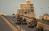 Fighters of a military battalion loyal to Libyan General Khalifa Hafta patrol the streets in the eastern city of Benghazi during a state of emergency to combat the coronavirus outbreak, on March 21, 2020. (Abdullah DOMA / AFP)