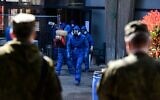 A Russian Army specialist walks outside the Honegger nursing home where 35 people have died so far from coronavirus in Albino, Italy, on March 28, 2020, amid the spread of the COVID-19 (new coronavirus) pandemic. (Piero CRUCIATTI / AFP)