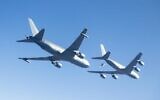 A Boeing KC-46A (L) conducts tests in 2015 over Edwards Air Force Base in California -- the tanker program has faced significant delays (AFP Photo/Handout)