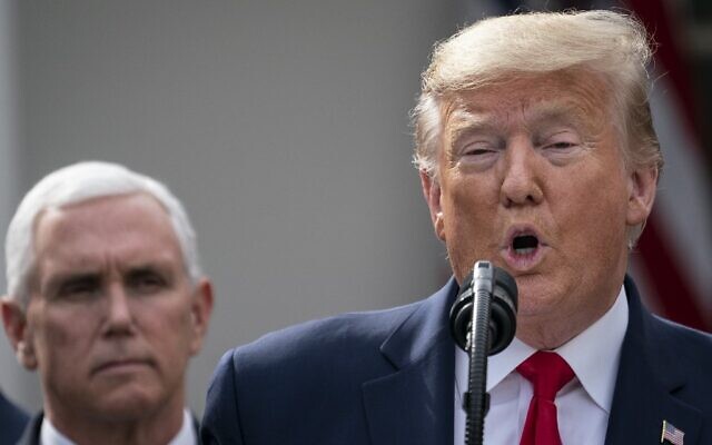 US Vice President Mike Pence (L) looks on as US President Donald Trump holds a press conference conference about the ongoing global coronavirus pandemic at the White House, March 13, 2020, in Washington. (Drew Angerer/Getty Images/AFP) US Vice President Mike Pence (L) looks on as US President Donald Trump holds a press conference conference about the ongoing global coronavirus pandemic at the White House, March 13, 2020, in Washington. (Drew Angerer/Getty Images/AFP)