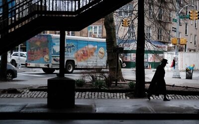 People walk through the empty streets of the Boro Park neighborhood on March 19, 2020 in the Brooklyn borough of New York City. (Spencer Platt/Getty Images/AFP)