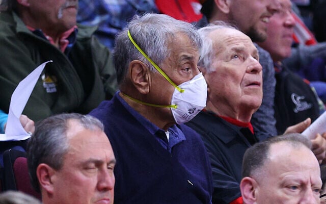 A fan wears a mask to protect against the coronavirus during the Big 10 wrestling championships at the Rutgers Athletic Center in Piscataway, New Jersey, March 7, 2020. (Rich Graessle/Icon Sportswire via Getty Images via JTA) A fan wears a mask to protect against the coronavirus during the Big 10 wrestling championships at the Rutgers Athletic Center in Piscataway, New Jersey, March 7, 2020. (Rich Graessle/Icon Sportswire via Getty Images via JTA)