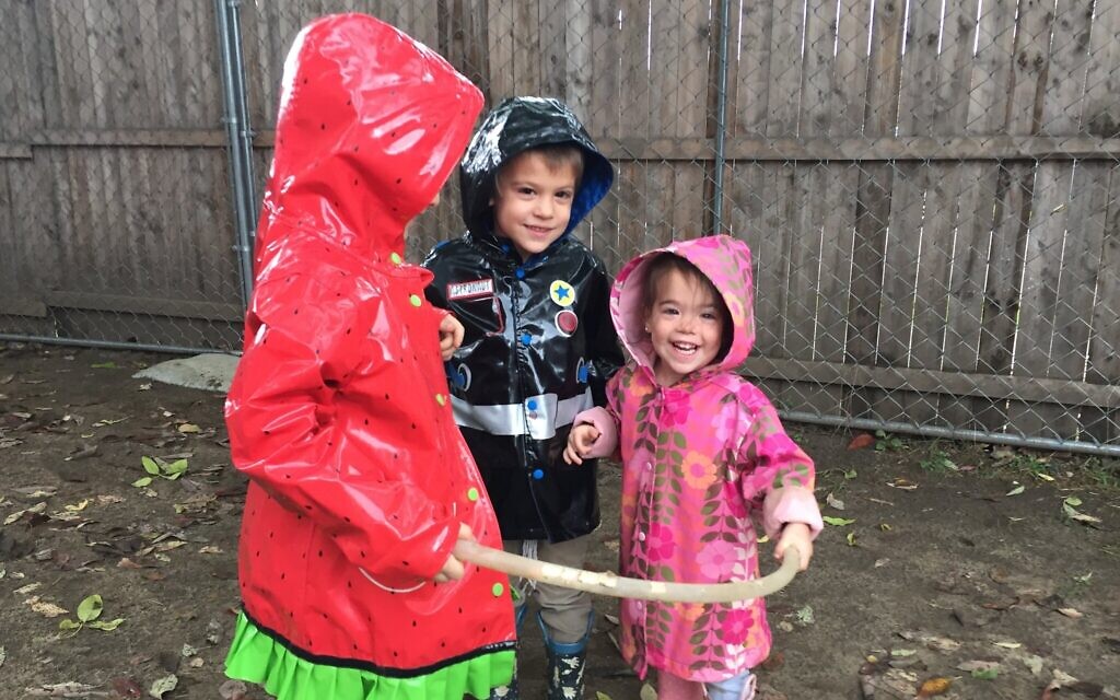 Kids at the Chabad-run preschool in Burlington, Vermont, play in the yard. (Courtesy of Draizy Junik/ via JTA)