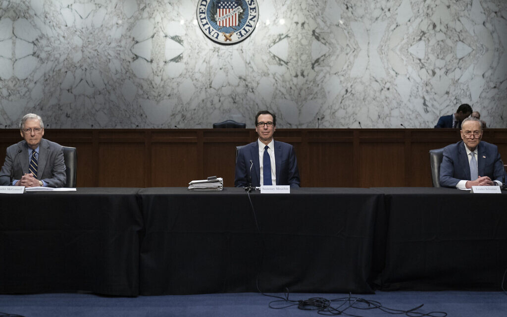 Socially distanced apart, from left, US Senate Majority Leader Mitch McConnell, Treasury Secretary Steve Mnuchin and Senate Minority Leader Chuck Schumer at a meeting on Capitol Hill in Washington, March 20, 2020. (Drew Angerer/Getty Images/ via JTA) Socially distanced apart, from left, US Senate Majority Leader Mitch McConnell, Treasury Secretary Steve Mnuchin and Senate Minority Leader Chuck Schumer at a meeting on Capitol Hill in Washington, March 20, 2020. (Drew Angerer/Getty Images/ via JTA)
