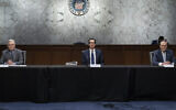 Socially distanced apart, from left, US Senate Majority Leader Mitch McConnell, Treasury Secretary Steve Mnuchin and Senate Minority Leader Chuck Schumer at a meeting on Capitol Hill in Washington, March 20, 2020. (Drew Angerer/Getty Images/ via JTA)