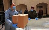 Palestinians bringing meals to quarantined people in Bethlehem on March 15, 2020. (Adam Rasgon/Times of Israel)