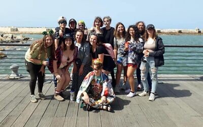 URJ Heller High students in Tel Aviv, shown dressed up in Purim costumes, are all being flown home to the U.S. (URJ Heller High/Facebook via JTA)