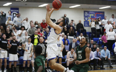 Maccabees guard Eitan Halpert (15) jumps for a layup in the second half of the Skyline Conference semifinal game against Farmingdale State College at Yeshiva University in New York, Feb. 27, 2020. Yeshiva won 74-69, advancing to the championship game against Purchase College. (AP Photo/Jessie Wardarski)