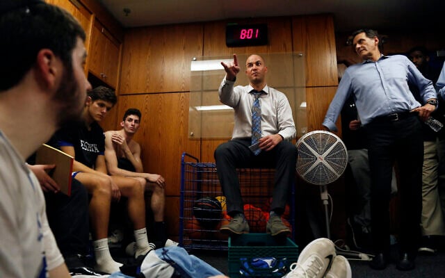Head coach Elliot Steinmetz talks to the Yeshiva University Maccabees in the locker room after they beat US Merchant Marine Academy, 75-57, Tuesday, Feb. 25, 2020. (AP Photo/Jessie Wardarski) Head coach Elliot Steinmetz talks to the Yeshiva University Maccabees in the locker room after they beat US Merchant Marine Academy, 75-57, Tuesday, Feb. 25, 2020. (AP Photo/Jessie Wardarski)
