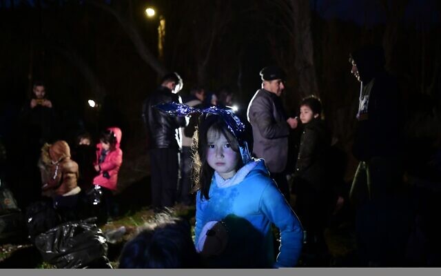 Migrants arrive at the village of Skala Sikaminias, on the Greek island of Lesbos, after crossing on a dinghy the Aegean sea from Turkey, March 1, 2020. (Michael Varaklas/AP)