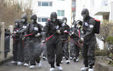 Soldiers spray disinfectant as a precaution against a new coronavirus at an apartment building in Daegu, South Korea, March 9, 2020. (Kim Ju-sung/Yonhap via AP)