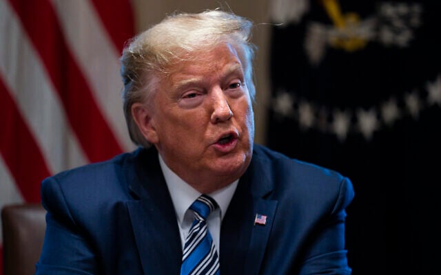 US President Donald Trump speaks during a meeting with banking industry executives at the White House, in Washington, March 11, 2020. (Evan Vucci/AP) US President Donald Trump speaks during a meeting with banking industry executives at the White House, in Washington, March 11, 2020. (Evan Vucci/AP)