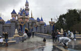 Visitors take photos at Disneyland in Anaheim, Calif., Friday, March 13, 2020. Disneyland is closing its doors for the rest of the month, shuttering one of California's best-known attractions as the state hurries to stop the spread of the coronavirus. (AP/Amy Taxin)