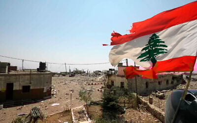 In this August 16, 2006 photo, a Lebanese flag flies over Khiam prison, in the southern town of Khiam, Lebanon. (AP Photo/Nasser Nasser, File)