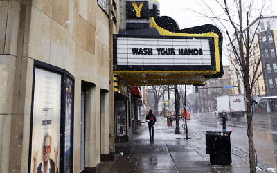 The Varsity Theater, home to concerts, used the marquee to address the need for washing hands due to the coronavirus, the disease that is caused by the new coronavirus, March 16, 2020 near the University of Minnesota in Minneapolis. (AP Photo/Jim Mone)