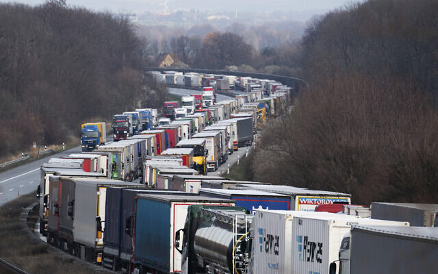 Trucks are jammed on the motorway A4 near Bautzen, Germany, Tuesday, March 17, 2020. Because of the controls at the border with Poland, a traffic jam formed on the Autobahn 4 between Dresden and Goerlitz, which, according to police, had grown to a length of 40 kilometers by noon. (Robert Michael/dpa via AP) Trucks are jammed on the motorway A4 near Bautzen, Germany, Tuesday, March 17, 2020. Because of the controls at the border with Poland, a traffic jam formed on the Autobahn 4 between Dresden and Goerlitz, which, according to police, had grown to a length of 40 kilometers by noon. (Robert Michael/dpa via AP)