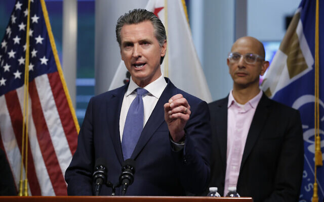California Governor Gavin Newsom gives an update on the US state's response to the coronavirus, at the Governor's Office of Emergency Services in Rancho Cordova California, March 17, 2020. At right is California Health and Human Services Agency Director Dr. Mark Ghaly. (AP Photo/Rich Pedroncelli, Pool) California Governor Gavin Newsom gives an update on the US state's response to the coronavirus, at the Governor's Office of Emergency Services in Rancho Cordova California, March 17, 2020. At right is California Health and Human Services Agency Director Dr. Mark Ghaly. (AP Photo/Rich Pedroncelli, Pool)