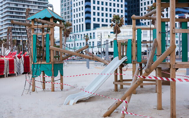 This March 19, 2020 photo shows playground at Tel Aviv's beachfront wrapped in tape to prevent public access.(AP Photo/Oded Balilty) This March 19, 2020 photo shows playground at Tel Aviv's beachfront wrapped in tape to prevent public access.(AP Photo/Oded Balilty)