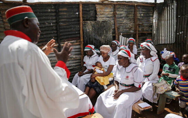 Christian faithful of the Africa Inland Church attend a Sunday mass service in the Kibera slum of the capital Nairobi, Kenya, Sunday, March 22, 2020. (AP Photo/Brian Inganga) Christian faithful of the Africa Inland Church attend a Sunday mass service in the Kibera slum of the capital Nairobi, Kenya, Sunday, March 22, 2020. (AP Photo/Brian Inganga)
