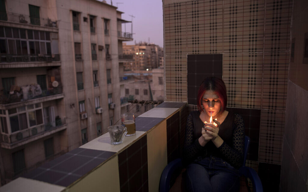 Egyptian transgender woman and activist Malak el-Kashif smokes a cigarette in the balcony of her apartment in Cairo, Egypt, October 28, 2019. (AP Photo/Nariman El-Mofty) Egyptian transgender woman and activist Malak el-Kashif smokes a cigarette in the balcony of her apartment in Cairo, Egypt, October 28, 2019. (AP Photo/Nariman El-Mofty)