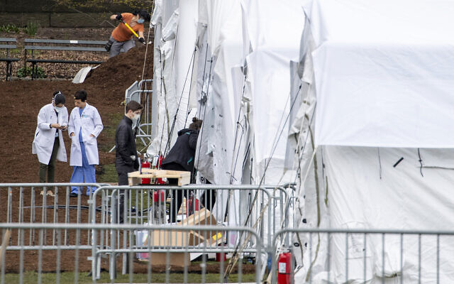 A Samaritan's Purse crew and medical personnel work on preparing to open a 68 bed emergency field hospital specially equipped with a respiratory unit in New York's Central Park, Tuesday, March 31, 2020, in New York. (AP Photo/Mary Altaffer) A Samaritan's Purse crew and medical personnel work on preparing to open a 68 bed emergency field hospital specially equipped with a respiratory unit in New York's Central Park, Tuesday, March 31, 2020, in New York. (AP Photo/Mary Altaffer)