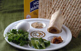 Illustrative: The Passover Seder plate, as shown in this March 8th, 2007 photo, is a special plate containing symbolic foods used by Jews during the Passover Seder.  The items include (from top center): horseradish; a shank bone; a mixture of fruit, wine and nuts called haroset; lettuce, parsley and an egg. (AP Photo/Dan Goodman)