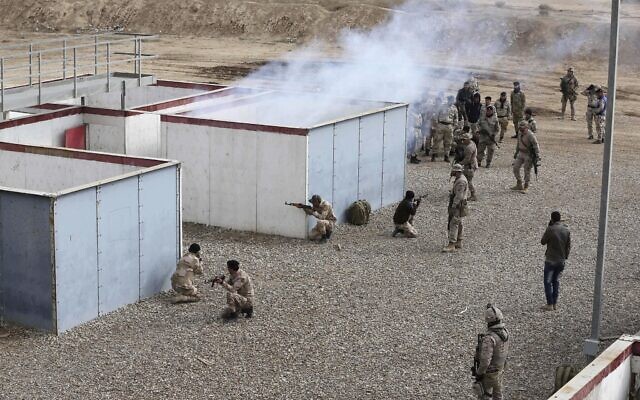 Illustrative: Nineveh police forces train with Spanish coalition members at Basmaya base southeast of Baghdad, Iraq, February 1, 2017. (Karim Kadim/AP) Illustrative: Nineveh police forces train with Spanish coalition members at Basmaya base southeast of Baghdad, Iraq, February 1, 2017. (Karim Kadim/AP)