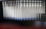 Pipettes containing immune cells for testing against possible flu vaccines are seen in the Vaccine Research Center at the National Institutes of Health, Tuesday, Dec. 19, 2017, in Bethesda, Md  (AP Photo/Carolyn Kaster)