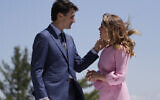 Canadian Prime Minister Justin Trudeau and his wife Sophie Gregoire Trudeau talk prior to the beginning of a welcoming ceremony during the G7 Summit, Friday, June 8, 2018, in Charlevoix, Canada. (AP/Evan Vucci)