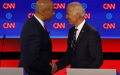 Sen. Cory Booker shakes hands with former Vice President Joe Biden after the second of two Democratic presidential primary debates, July 31, 2019, in the Fox Theatre in Detroit. (AP Photo/Paul Sancya)