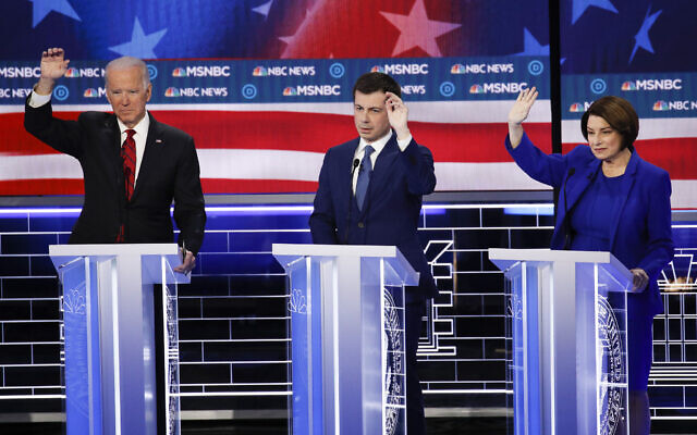 Former US vice president Joe Biden, from left, former South Bend Mayor Pete Buttigieg, Minnesota Senator Amy Klobuchar gesture during a Democratic presidential primary debate on February 19, 2020, in Las Vegas, hosted by NBC News and MSNBC. (AP Photo/John Locher) Former US vice president Joe Biden, from left, former South Bend Mayor Pete Buttigieg, Minnesota Senator Amy Klobuchar gesture during a Democratic presidential primary debate on February 19, 2020, in Las Vegas, hosted by NBC News and MSNBC. (AP Photo/John Locher)