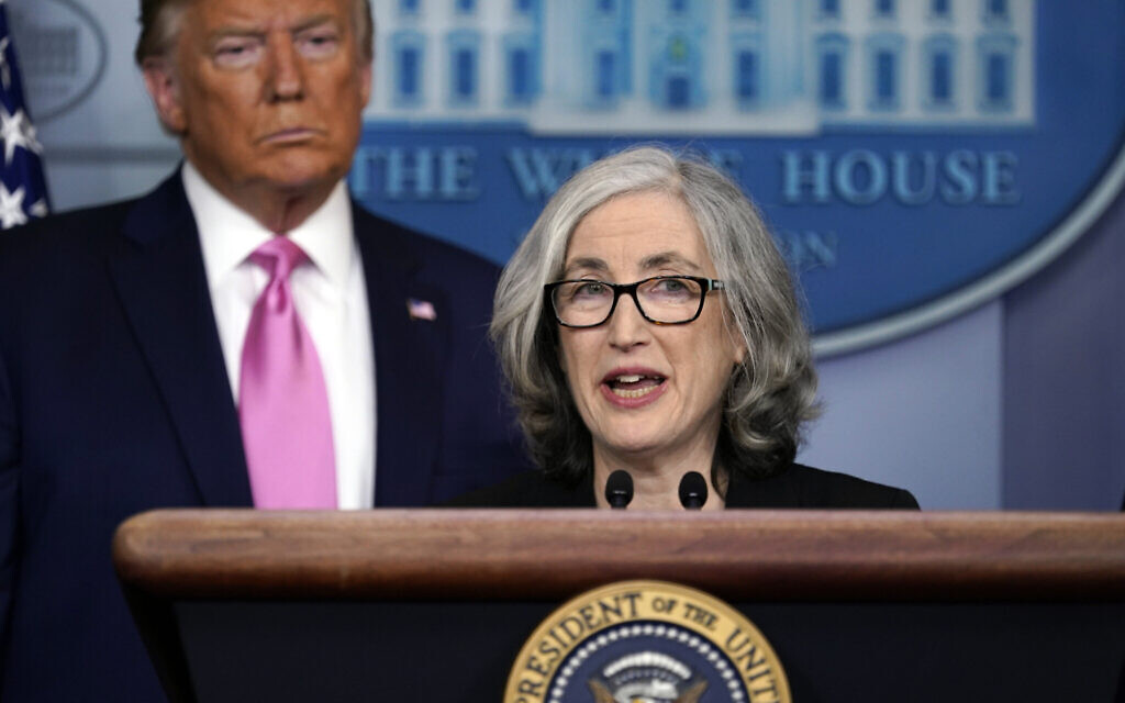 US President Donald Trump listens as Anne Schuchat, principal deputy director of the Centers for Disease Control and Prevention, speaks during a news conference about the coronavirus in the Brady Press Briefing Room of the White House, February 26, 2020, in Washington. (AP Photo/Evan Vucci)
