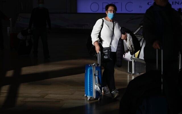A woman wearing a protective mask arrives in Ben Gurion Airport, near Tel Aviv, Israel, Thursday, Feb. 27, 2020. (AP/Ariel Schalit) A woman wearing a protective mask arrives in Ben Gurion Airport, near Tel Aviv, Israel, Thursday, Feb. 27, 2020. (AP/Ariel Schalit)