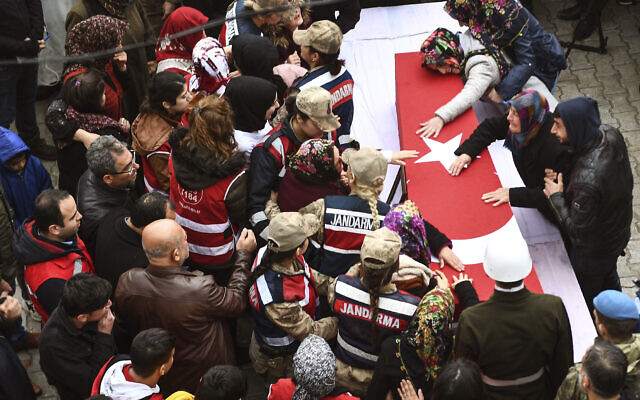 People react by the coffin during a funeral ceremony for Emin Yildirim, one of the 36 Turkish soldiers killed on Thursday in a Syrian army attack in the Idlib area of Syria, in Hatay, Turkey, Saturday, Feb. 29, 2020. (AP Photo) People react by the coffin during a funeral ceremony for Emin Yildirim, one of the 36 Turkish soldiers killed on Thursday in a Syrian army attack in the Idlib area of Syria, in Hatay, Turkey, Saturday, Feb. 29, 2020. (AP Photo)