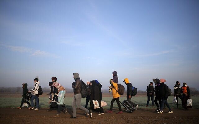 Migrants walk to reach Pazarakule border gate, Edirne, Turkey, at the Turkish-Greek border, March 1, 2020. (Emre Tazegul/AP)