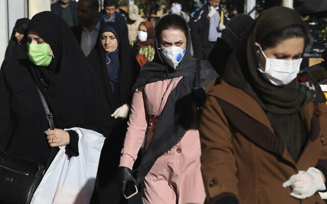 People wearing face masks in downtown Tehran, Iran, March 2, 2020. (AP Photo Vahid Salemi) People wearing face masks in downtown Tehran, Iran, March 2, 2020. (AP Photo Vahid Salemi)