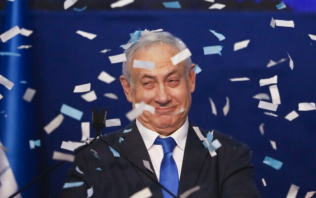 Israeli Prime Minister Benjamin Netanyahu smiles after first exit poll results for the Israeli elections at his party's headquarters in Tel Aviv, March 3, 2020. (AP/Ariel Schalit) Israeli Prime Minister Benjamin Netanyahu smiles after first exit poll results for the Israeli elections at his party's headquarters in Tel Aviv, March 3, 2020. (AP/Ariel Schalit)