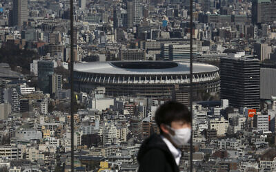 The New National Stadium, a venue for the opening and closing ceremonies at the Tokyo 2020 Olympics, is seen from Shibuya Sky observation deck in Tokyo, March 3, 2020 (AP Photo/Jae C. Hong)