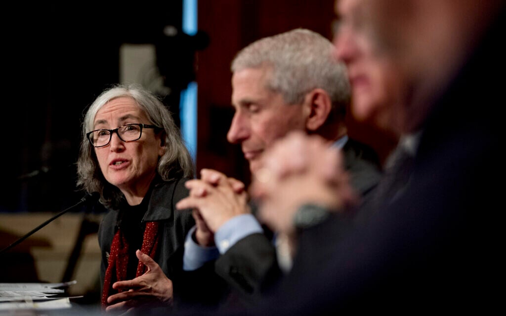 Centers for Disease Control and Prevention Principal Deputy Director Anne Schuchat, center, accompanied by National Institute for Allergy and Infectious Diseases Director Dr. Anthony Fauci, right, testifies before a Senate Health, Education, Labor and Pensions Committee hearing on the coronavirus on Capitol Hill, Tuesday, March 3, 2020, in Washington. (AP Photo/Andrew Harnik)