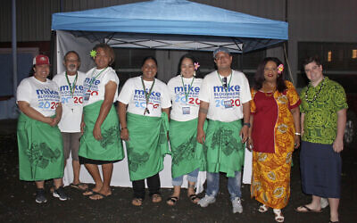 Supporters along with two US based officials for the Mike Bloomberg campaign gather on March 3, 2020, in Tafuna village near Pago Pago, American Samoa (AP Photo/Fili Sagapolutele)
