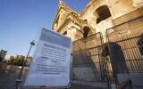 A sign advises that Colosseum will be closed, following the government's new prevention measures on public gatherings, in Rome, March 8, 2020. (Andrew Medichini/AP)