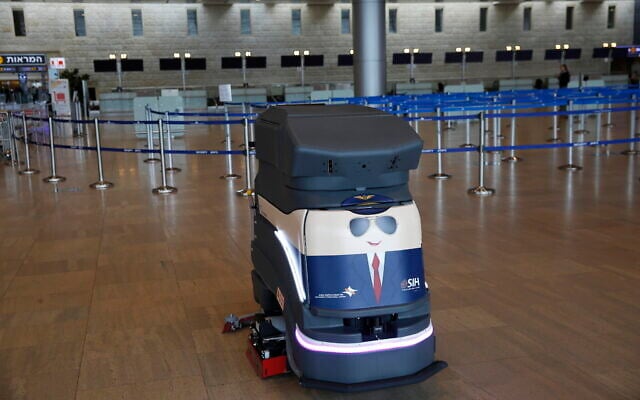 A robot cleans the hall of empty check-in counters at the Ben Gurion Airport near Tel Aviv, Israel, Tuesday, March 10, 2020. (AP/Ariel Schalit) A robot cleans the hall of empty check-in counters at the Ben Gurion Airport near Tel Aviv, Israel, Tuesday, March 10, 2020. (AP/Ariel Schalit)