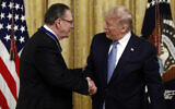 President Donald Trump shakes hands after presenting the Presidential Medal of Freedom to former Vice Chief of Staff of the Army Gen. Jack Keane in the East Room of the White House in Washington, Tuesday, March 10, 2020. (AP/Patrick Semansky)