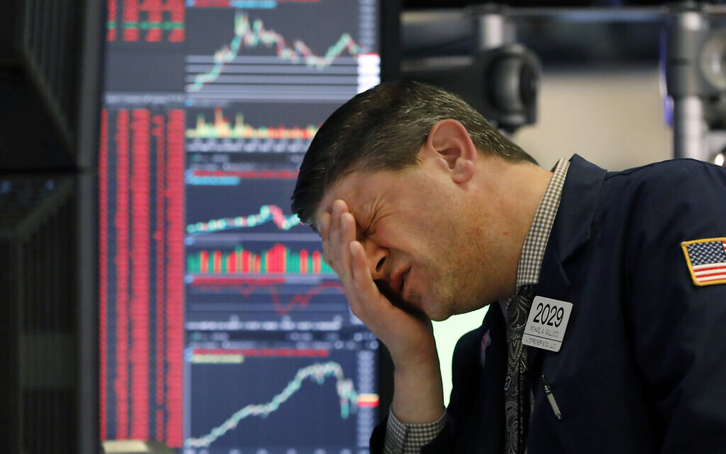 A trader works at his post on the floor of the New York Stock Exchange, March 11, 2020. (AP Photo/Richard Drew) A trader works at his post on the floor of the New York Stock Exchange, March 11, 2020. (AP Photo/Richard Drew)