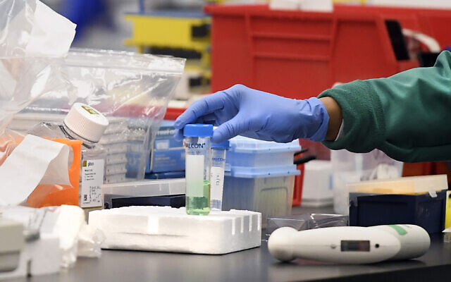 Illustrative: A researcher with a vial in a lab, March 12, 2020, in Meriden, Connecticut, amidst researching a vaccine for COVID-19. (AP Photo/Jessica Hill) Illustrative: A researcher with a vial in a lab, March 12, 2020, in Meriden, Connecticut, amidst researching a vaccine for COVID-19. (AP Photo/Jessica Hill)