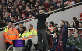 In this Saturday, March 7, 2020 photo Arsenal's head coach Mikel Arteta reacts during the Premier League soccer match between Arsenal and West Ham at the Emirates Stadium in London. (AP/Matt Dunham)