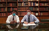 In this handout photo released by Brazil's Presidential Press Office, Brazilian Health Minister Luiz Henrique Mandetta, left, and President Jair Bolsonaro, wear masks as they speak about the new coronavirus during a Facebook Live transmission, in Brasilia, Brazil, Thursday, March 12, 2020.(Brazil's Presidential Press Office via AP)