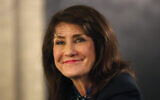 Democrat Marie Newman smiles as she campaigns in the Archer Heights neighborhood of Chicago on March 9, 2020. (AP Photo/Charles Rex Arbogast)
