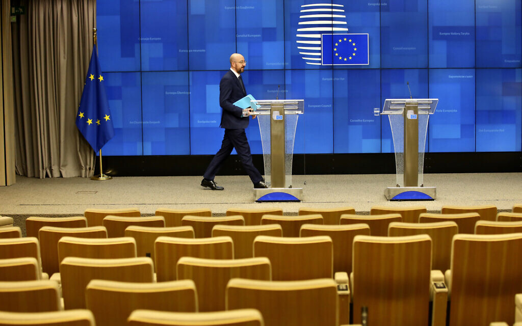 European Council President Charles Michel arrives to address a nearly empty press theater after a videoconference with G7 leaders at the European Council building in Brussels, March 16, 2020. (AP Photo/Olivier Matthys) European Council President Charles Michel arrives to address a nearly empty press theater after a videoconference with G7 leaders at the European Council building in Brussels, March 16, 2020. (AP Photo/Olivier Matthys)