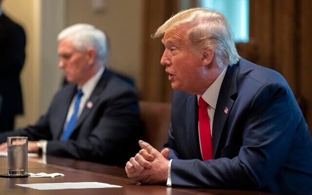 US President Donald Trump speaks about the coronavirus in the Cabinet Room of the White House during a meeting with representatives of American nurses, Wednesday, March 18, 2020, in Washington. (AP Photo/Alex Brandon) US President Donald Trump speaks about the coronavirus in the Cabinet Room of the White House during a meeting with representatives of American nurses, Wednesday, March 18, 2020, in Washington. (AP Photo/Alex Brandon)